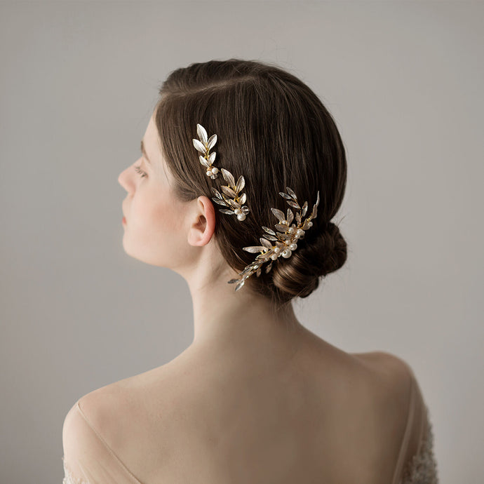 Woman wearing wedding hair piece from back